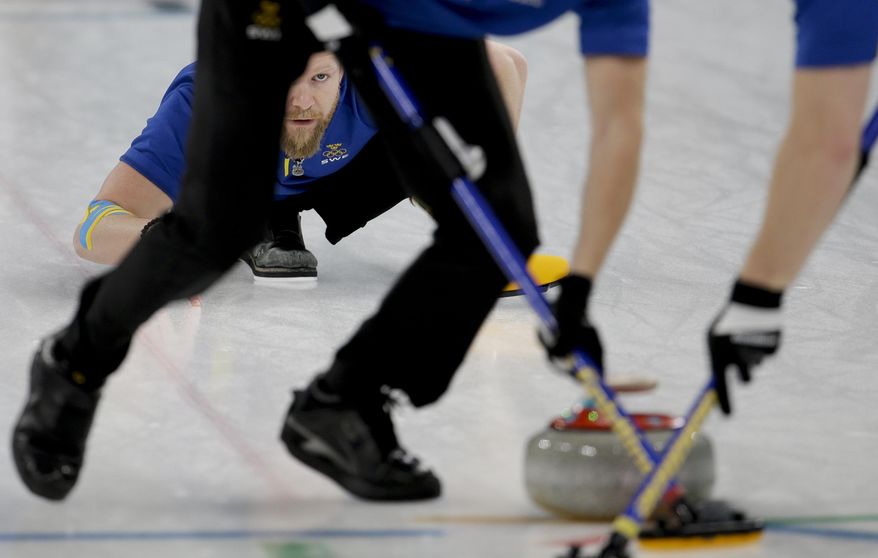 Sweden&#39;s skip Niklas Edin watches his teammates sweep the ice during the men&#39;s final curling match against THE United States at the 2018 Winter Olympics in Gangneung, South Korea, Saturday, Feb. 24, 2018. (AP Photo/Natacha Pisarenko)