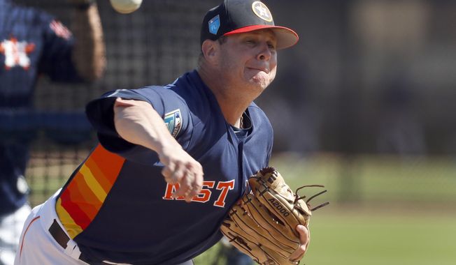 FILE - In this Feb. 19, 2018, file photo, Houston Astros pitcher Brad Peacock throws live batting practice during spring training baseball practice in West Palm Beach, Fla. Last spring Brad Peacock entered Astros camp worried that he wouldn&#x27;t make the team. After the best season of his career, the right-hander&#x27;s spot with the Astros is secure this season, but he&#x27;s maintained the same mindset he had when his career was on the line. &amp;quot;I still want to keep that edge on me,&amp;quot; he said.(AP Photo/Jeff Roberson)