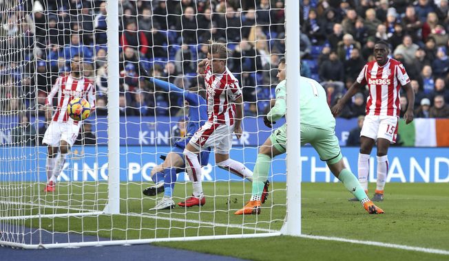 Stoke City goalkeeper Jack Butland, second right, scores an own goal during the English Premier League soccer match, Leicester City against Stoke City, at the King Power Stadium, Leicester, England, Saturday Feb. 24, 2018. (Nick Potts/PA via AP)