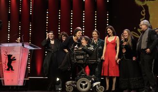 The team of &#39;Touch me not&#39; pose on the stage after receiving a golden bear as best film during the awarding ceremony of the 68th edition of the International Film Festival Berlin, Berlinale, in Berlin, Germany, Saturday, Feb. 24, 2018. (AP Photo/Markus Schreiber)
