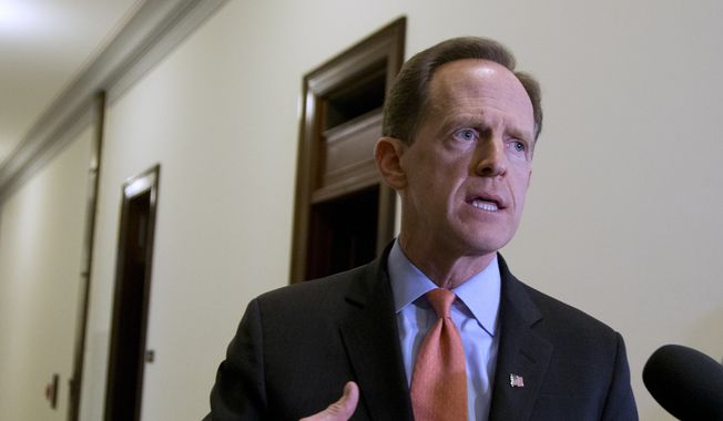 In this April 12, 2016, file photo, Sen. Patrick J. Toomey, R-Pa., speaks to reporters outside his office on Capitol Hill, in Washington.  (AP Photo/Manuel Balce Ceneta, File)