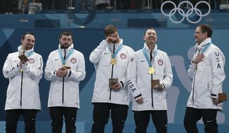 Gold medal winners from left: United States&#x27; curlers Joe Polo, John Landsteiner, Matt Hamilton, Tyler George, John Shuster and captain Phill Drobnick stand on the podium during the men&#x27;s curling venue ceremony at the 2018 Winter Olympics in Gangneung, South Korea, Saturday, Feb. 24, 2018. (AP Photo/Natacha Pisarenko)