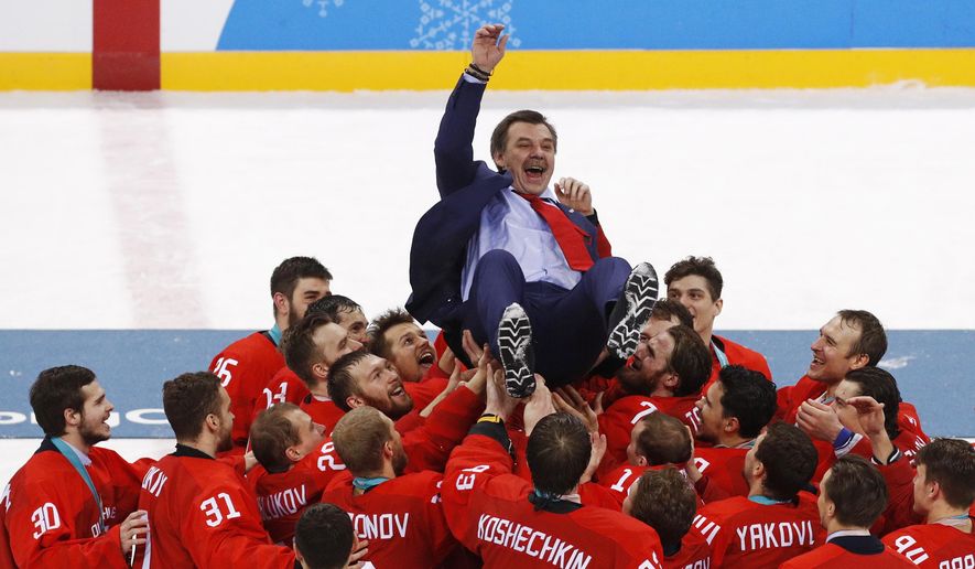 Olympic athletes from Russia celebrate with their coach Oleg Znarok after winning the men&#39;s gold medal hockey game against Germany, 4-3, in overtime at the 2018 Winter Olympics, Sunday, Feb. 25, 2018, in Gangneung, South Korea. (AP Photo/Jae C. Hong) **File**
