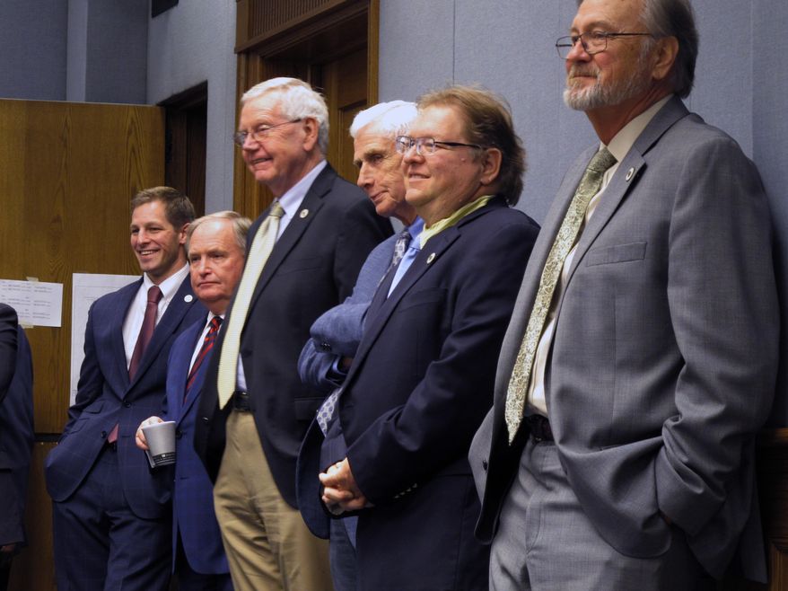 Lawmakers listen to the testimony and watch the votes on tax bills during the House Ways and Means Committee on Sunday, Feb. 25, 2018, in Baton Rouge, La. (AP Photo/Melinda Deslatte)