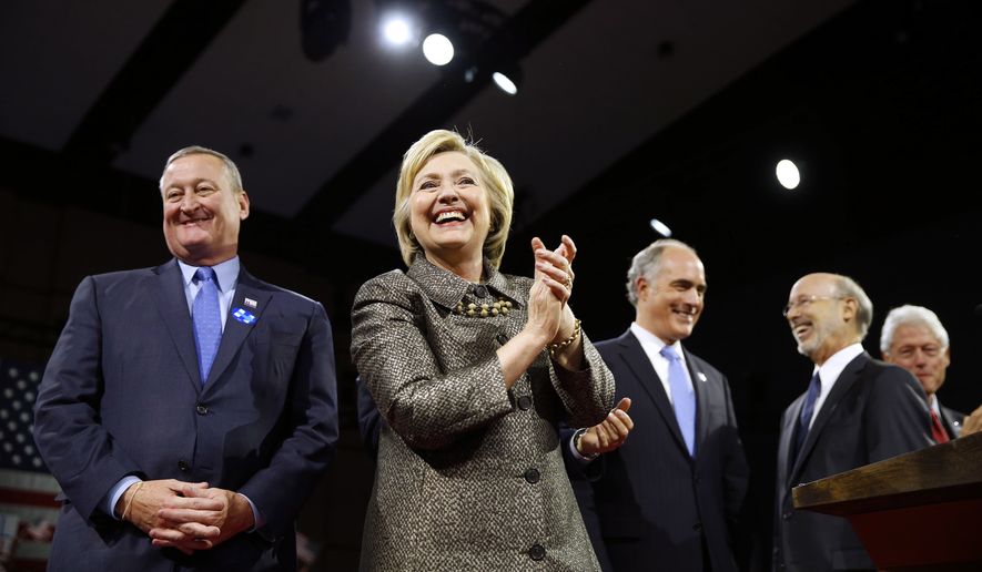 Democratic presidential candidate Hillary Clinton is accompanied by Philadelphia Mayor Jim Kenney, left, Sen. Bob Casey D-Pa., Gov. Tom Wolf, and former President Bill Clinton, stands on stage at her presidential primary election night rally, Tuesday, April 26, 2016, in Philadelphia. (AP Photo/Matt Rourke)