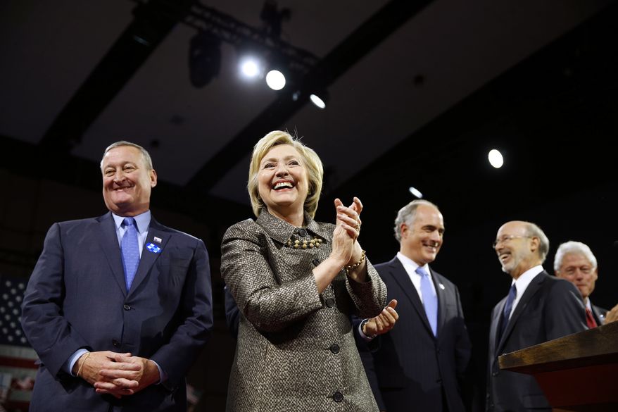 Democratic presidential candidate Hillary Clinton is accompanied by Philadelphia Mayor Jim Kenney, left, Sen. Bob Casey D-Pa., Gov. Tom Wolf, and former President Bill Clinton, stands on stage at her presidential primary election night rally, Tuesday, April 26, 2016, in Philadelphia. (AP Photo/Matt Rourke)