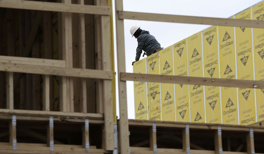Work continues on a new development in Fair Lawn, N.J., Monday, Feb. 26, 2018. (AP Photo/Seth Wenig) ** FILE **