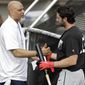 Tony Clark, left, head of the Major League Baseball Players Association, shakes hands with free agent player Chris Colabello before an exhibition baseball game against JR East, a Japanese amateur team, Tuesday, Feb. 27, 2018, in Bradenton, Fla. (AP Photo/Chris O&#39;Meara)