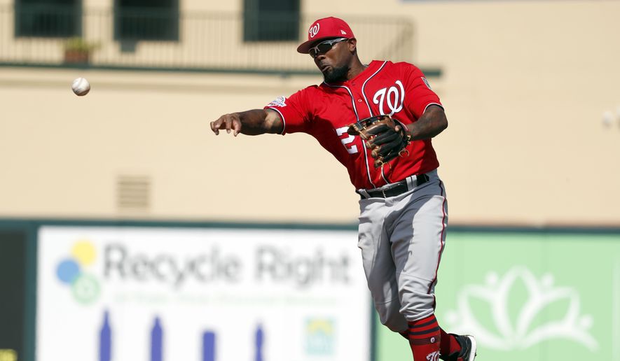 Washington Nationals second baseman Howie Kendrick throws to first during the third inning of an exhibition spring training baseball game against the Marlins Wednesday, Feb. 28, 2018, in Jupiter, Fla. (AP Photo/Jeff Roberson)