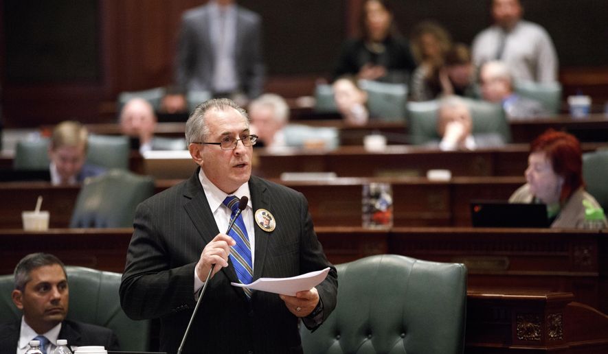 State Rep. Marty Moylan speaks on the floor before members of the House vote on legislation prohibiting bump stock and trigger cranks during a session at the State Capitol Wednesday Feb. 28, 2018, in Springfield, Ill. (Armando L. Sanchez/Chicago Tribune) ** FILE **