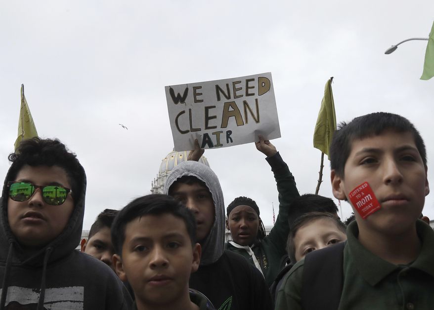 Students listen to speakers at a rally for clean energy in San Francisco, Wednesday, Feb. 28, 2018. California stands in &amp;quot;complete opposition&amp;quot; to a Trump administration plan to scrap a policy slashing climate-changing emissions from power plants, its top air official said Wednesday at a U.S. hearing in a state helping lead the fight against global warming. (AP Photo/Jeff Chiu) **FILE**