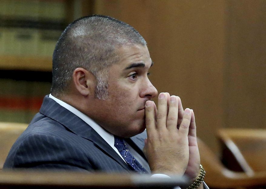 FILE - In this Oct 13, 2016, file photo, McLennan County District Attorney Abel Reyna looks on during a pretrial hearing involving the biker shoot out at Twin Peaks restaurant in Waco, Texas. Reyna dismissed 13 more cases against bikers stemming from a 2015 shootout in Waco involving bikers and police. Reyna made the announcement Wednesday, Feb. 28, 2018, a day before scheduled hearings for 10 of the bikers. (Rod Aydelotte/Waco Tribune-Herald via AP, File)