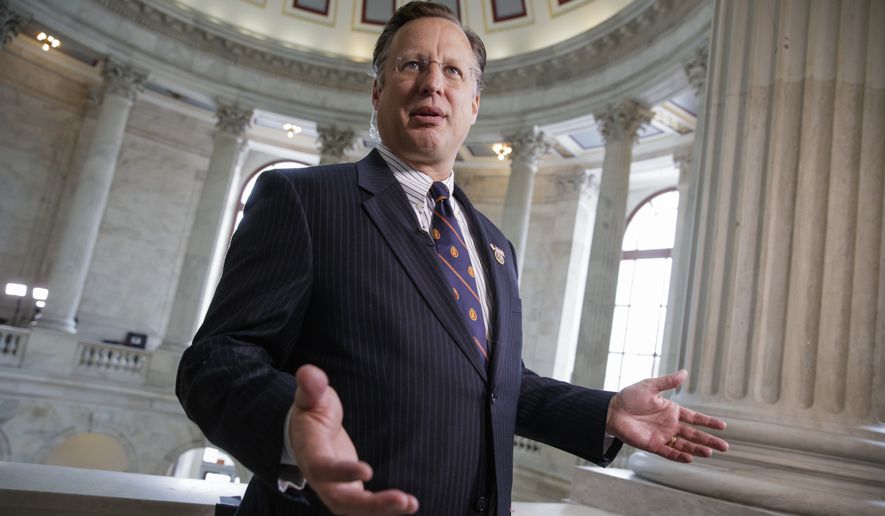 Rep. Dave Brat R-Va. talks to reporters on Capitol Hill in Washington, Wednesday, March, 15, 2017. Brat, who ousted House Majority Leader Eric Cantor in 2014, is a conservative member of the House Freedom Caucus, which is opposed to the GOP health care bill embraced by Speaker Paul Ryan. (AP Photo/J. Scott Applewhite)