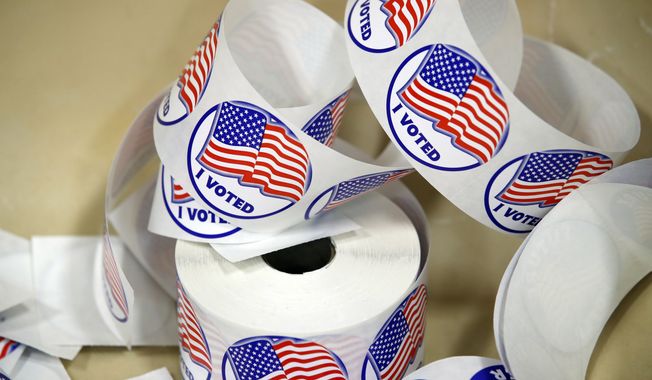 File photo of &quot;I Voted,&quot; stickers as seen at a polling place Tuesday, Nov. 7, 2017, in Alexandria, Va.  (AP Photo/Alex Brandon) **FILE**