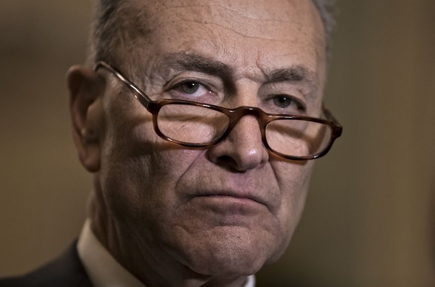 Senate Minority Leader Chuck Schumer, D-N.Y., meets with reporters as work continues on a plan to keep the government open as a funding deadline approaches, at the Capitol in Washington, Tuesday, Feb. 6, 2018. (AP Photo/J. Scott Applewhite)