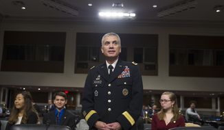 Army Lt. Gen. Paul Nakasone appears before the Senate Armed Services Committee to discuss his qualifications as nominee to be National Security Agency Director and U.S. Cyber Command Commander, during a hearing on Capitol Hill in Washington, Thursday, March 1, 2018. (AP Photo/Cliff Owen)
