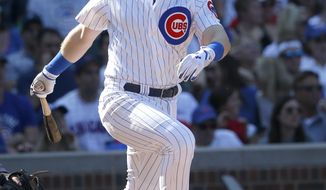 FILE - In this Sept. 15, 2017, file photo, Chicago Cubs&#39; Ian Happ watches his two-run single off St. Louis Cardinals relief pitcher Matt Bowman in the sixth inning of a baseball game, in Chicago. A year ago, Ian Happ was a top prospect looking for a spot on the crowded roster of the Chicago Cubs. Now he is looking to build off an impressive rookie season. (AP Photo/Charles Rex Arbogast, File)