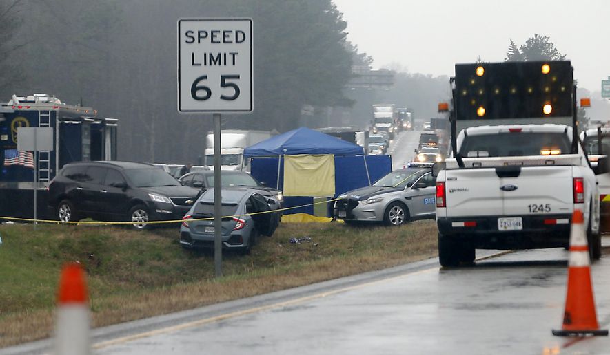 Virginia State Police are on the scene of an officer-involved shooting on Interstate 64 east of the airport exit in Henrico County Thursday, March 1, 2018. Virginia State Police say an armed man has been fatally shot by police on Interstate 64 after a vehicle chase. (Alexa Welch Edlund/Richmond Times-Dispatch via AP)