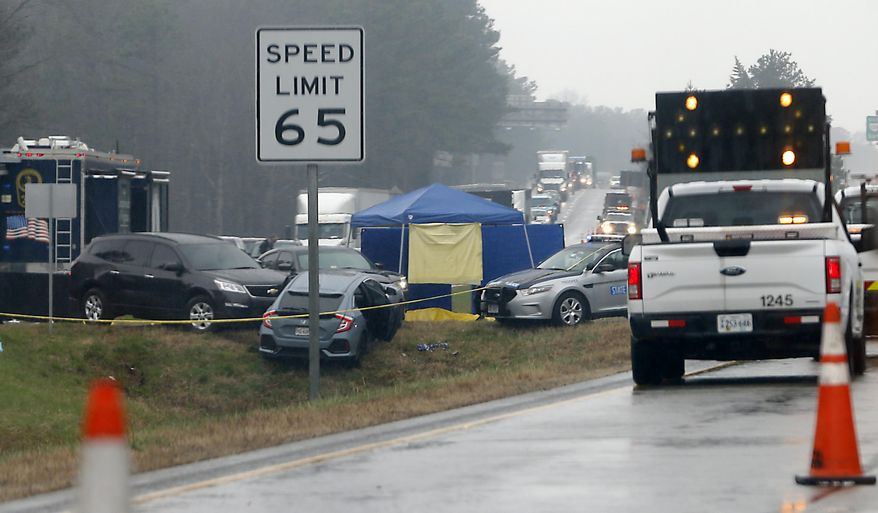 Virginia State Police are on the scene of an officer-involved shooting on Interstate 64 east of the airport exit in Henrico County Thursday, March 1, 2018. Virginia State Police say an armed man has been fatally shot by police on Interstate 64 after a vehicle chase. (Alexa Welch Edlund/Richmond Times-Dispatch via AP)
