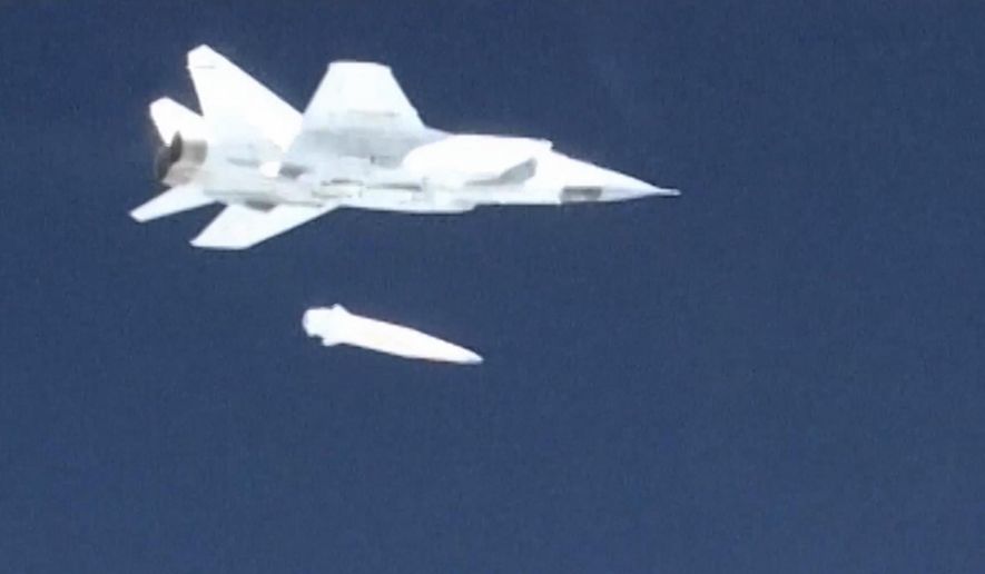 In this video grab provided by RU-RTR Russian television via AP television on Thursday, March 1, 2018, a Russian MiG-31 fighter jet releases the new Kinzhal hypersonic missile during a test at an undisclosed location in Russia. President Vladimir Putin declared Thursday that Russia has developed a range of new nuclear weapons, claiming they can&#x27;t be intercepted by enemy. (RU-RTR Russian Television via AP)