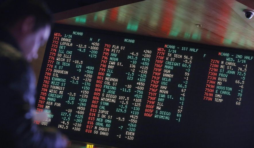 FILE - In this Jan. 14, 2015, file photo, odds are displayed on a screen at a sports book owned and operated by CG Technology in Las Vegas. New Jersey has challenged the Professional and Amateur Sports Protection Act, the 1992 law forbidding all but Nevada and three other states from authorizing gambling on college and professional sports. Only Nevada offers betting on single games. (AP Photo/John Locher, File)