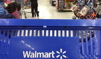 Authorities say Kari Milak Whitehead, 26, who according to court documents had converted to Islam, was watching Islamic State propaganda videos and had indicated he wanted to kill &quot;white people,&quot; tried to buy a rifle from a Walmart last month. (AP Photo/Elise Amendola, File)