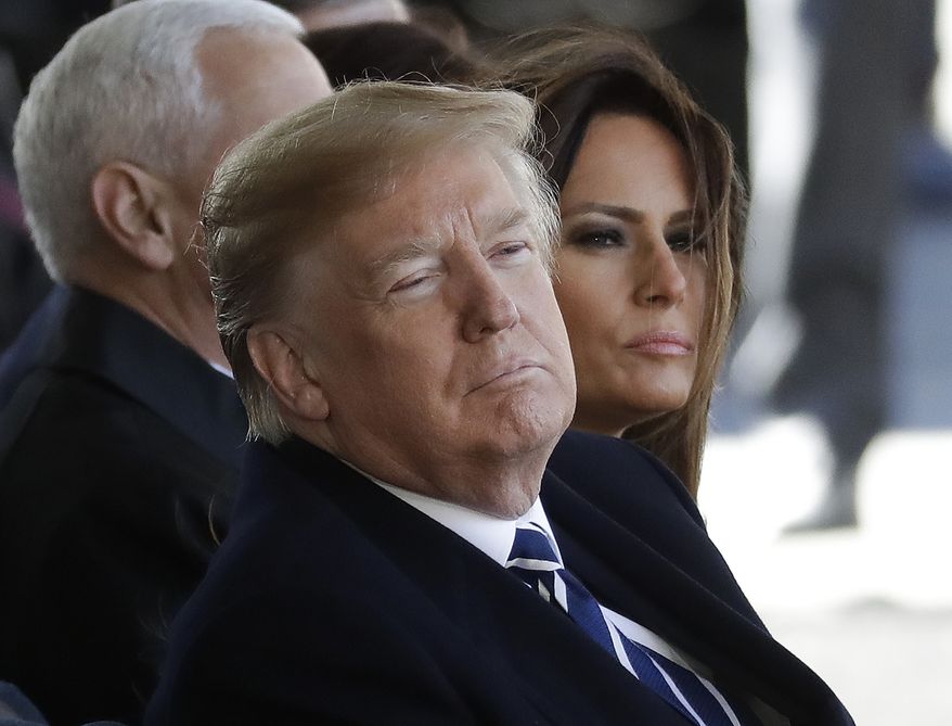 President Donald Trump and First lady Melania Trump listen to a sermon during a funeral service at the Billy Graham Library for the Rev. Billy Graham, who died last week at age 99, Friday, March 2, 2018, in Charlotte, N.C. (AP Photo/Chuck Burton)