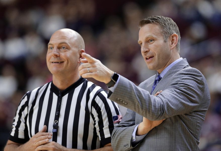 FILE - In this Dec. 21, 2017, file photo, Buffalo head coach Nate Oats talks with a referee during the first half of an NCAA college basketball game against Texas A&M, in College Station, Texas. Nate Oats was credited for doing a remarkable job in leading the University at Buffalo to an NCAA Tournament berth in his first season as coach. Two years later, Oats is showing that wasn't a fluke. (AP Photo/Michael Wyke, File)