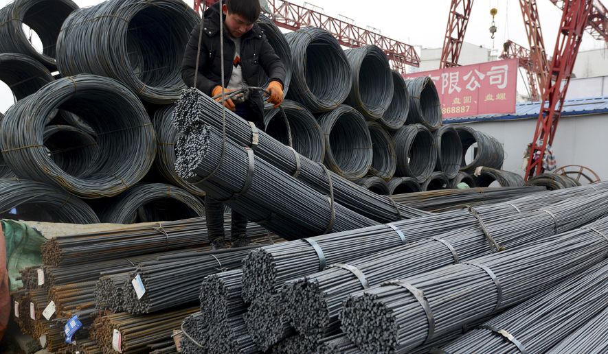 A worker loads steel products onto a vehicle at a steel market in Fuyang in central China&#39;s Anhui province Friday, March 2, 2018. China has expressed &amp;quot;grave concern&amp;quot; about a U.S. trade policy report that pledges to pressure Beijing but had no immediate response to President Donald Trump&#39;s plan to hike tariffs on steel and aluminum. The Commerce Ministry said Friday that Beijing has satisfied its trade obligations and appealed to Washington to settle disputes through negotiation (Chinatopix Via AP)