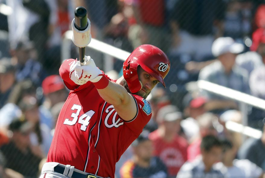 Washington Nationals' Bryce Harper swings in the on-deck circle as he prepares to bat during the fourth inning of an exhibition spring training baseball game against the Houston Astros Saturday, March 3, 2018, in West Palm Beach, Fla. (AP Photo/Jeff Roberson)