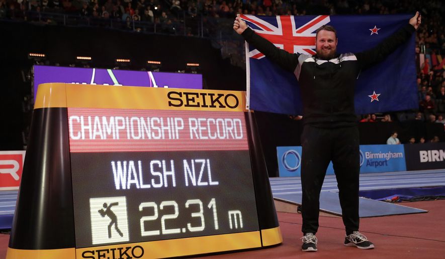 New Zealand's Tomas Walsh celebrates after winning the gold medal and setting a new championship record in the men's shot put final at the World Athletics Indoor Championships in Birmingham, Britain, Saturday, March 3, 2018. (AP Photo/Matt Dunham)