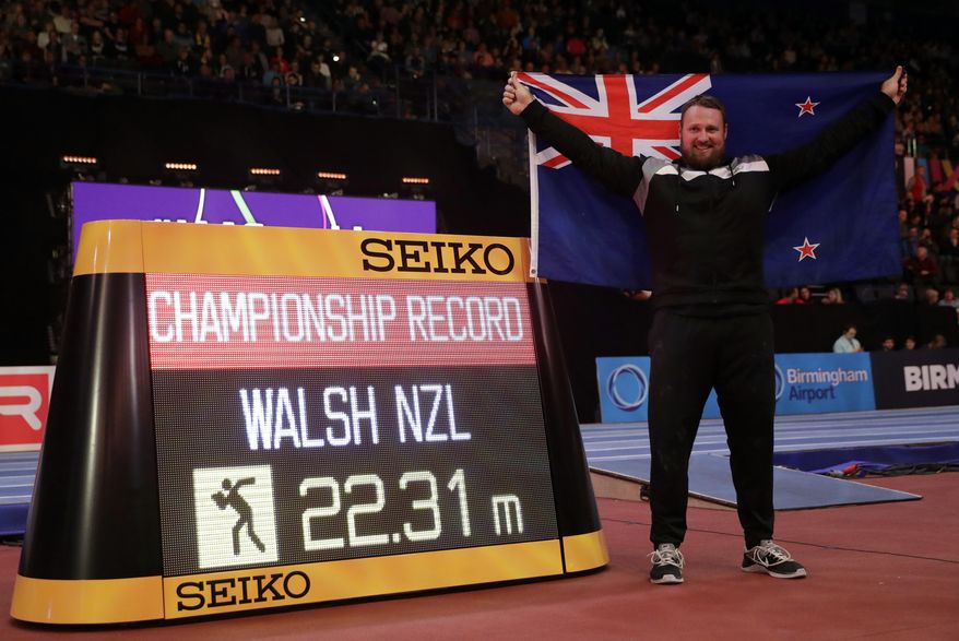 New Zealand's Tomas Walsh celebrates after winning the gold medal and setting a new championship record in the men's shot put final at the World Athletics Indoor Championships in Birmingham, Britain, Saturday, March 3, 2018. (AP Photo/Matt Dunham)