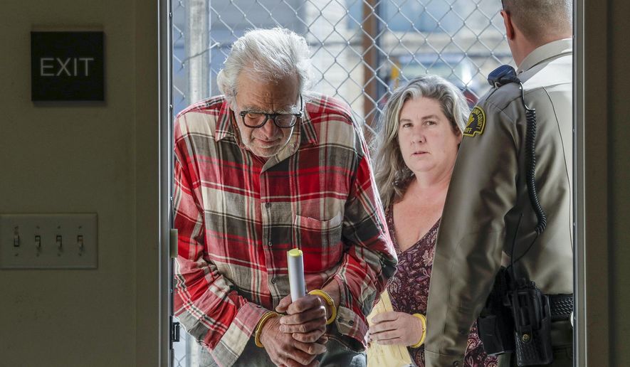 Daniel Panico, 73, and Mona Kirk, 51, appear in Joshua Tree Court, Friday March 2, 2018 in Joshua Tree, Calif. Two Southern California parents were arrested for suspicion of child cruelty after deputies found their three children living in a squalid desert shack without running water, bathrooms or electricity, sheriff's officials said Friday. (Irfan Khan/Los Angeles Times via AP)