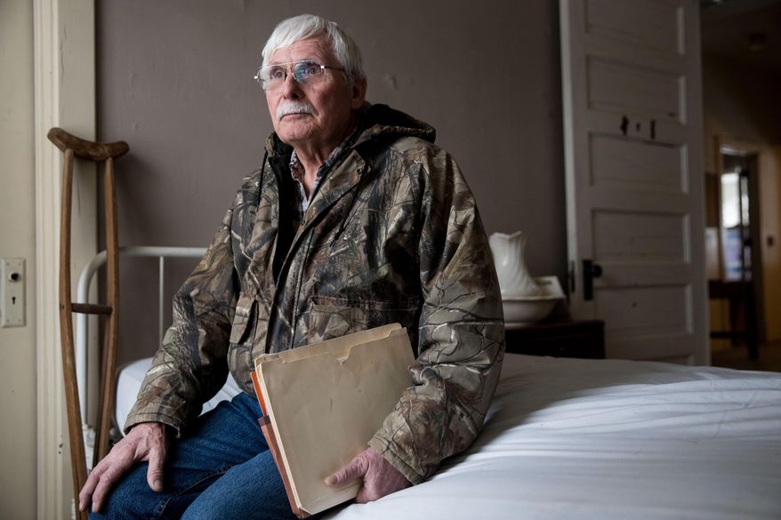 Keith Mahaney, Picotte Committee member, poses for a portrait at an exhibit in the Dr. Susan LaFlesche Picotte Memorial Hospital on Monday, Feb. 19, 2018, in Walthill, Neb. A new effort is underway to restore the three-story, 33-room building to honor the legacy of Dr. La Flesche Picotte. Officials say it could also help improve relations between whites and Natives, as well as inspire future generations.(Julia Nagy/Omaha World-Herald via AP)
