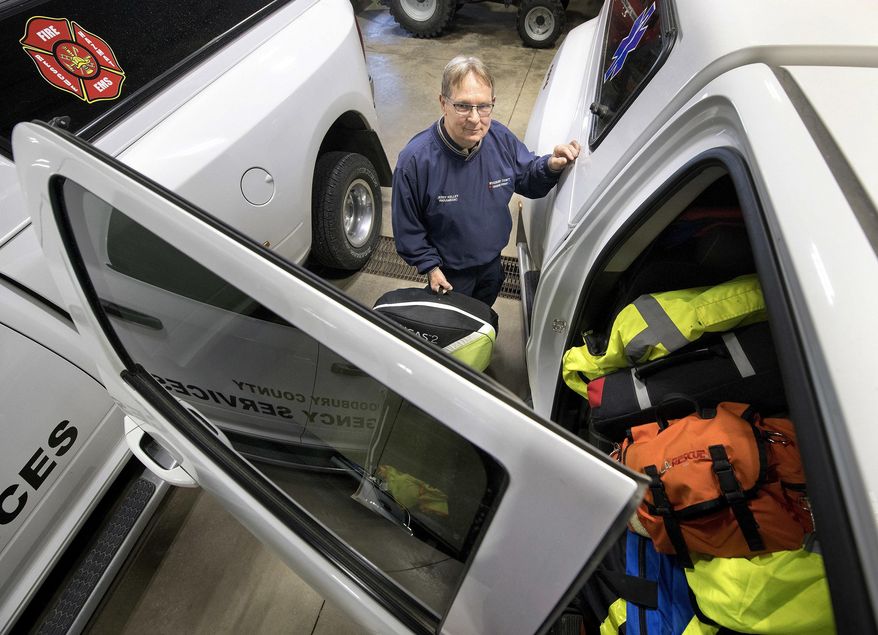 In this Feb. 21, 2018, photo, Jerry Kelley, the sole paramedic working for the Woodbury County Emergency Services Department, poses for a photo at the department's offices in Climbing Hill, Iowa. The only rural paramedic in Woodbury County, Kelley, awaits two new colleagues to be hired in July. (Tim Hynds/Sioux City Journal via AP)