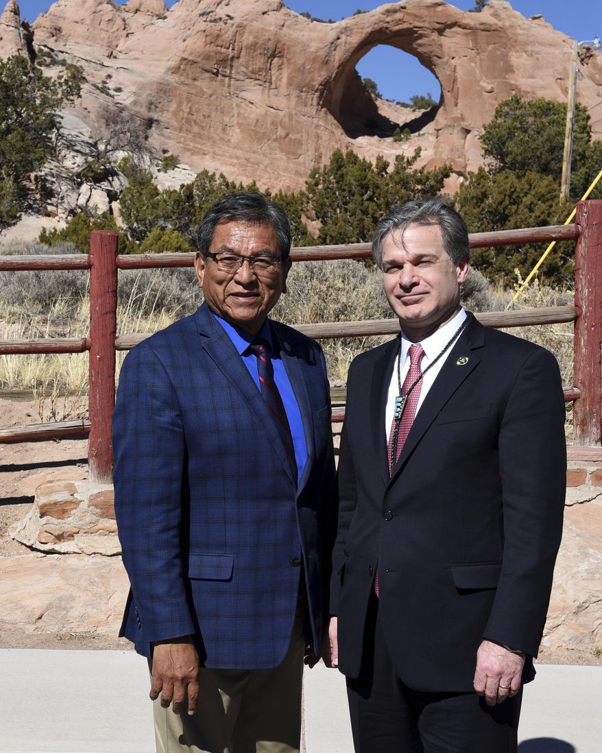 In this Friday, March 2, 2018, photo provided by the Federal Bureau of Investigations, shows Navajo Nation President Russell Begaye, left, with FBI Director Christopher Wray during a first visit to the tribal capital in Window Rock, Ariz. Wray arrived in the tribal capital in Window Rock, Ariz., on Friday, March 2 and spoke with Navajo Nation President Russell Begaye and other tribal and federal law enforcement officials, including FBI agents from New Mexico. FBI spokesman Frank Fisher says Wray's visit to the Navajo Nation was the first by a director. (FBI via AP)