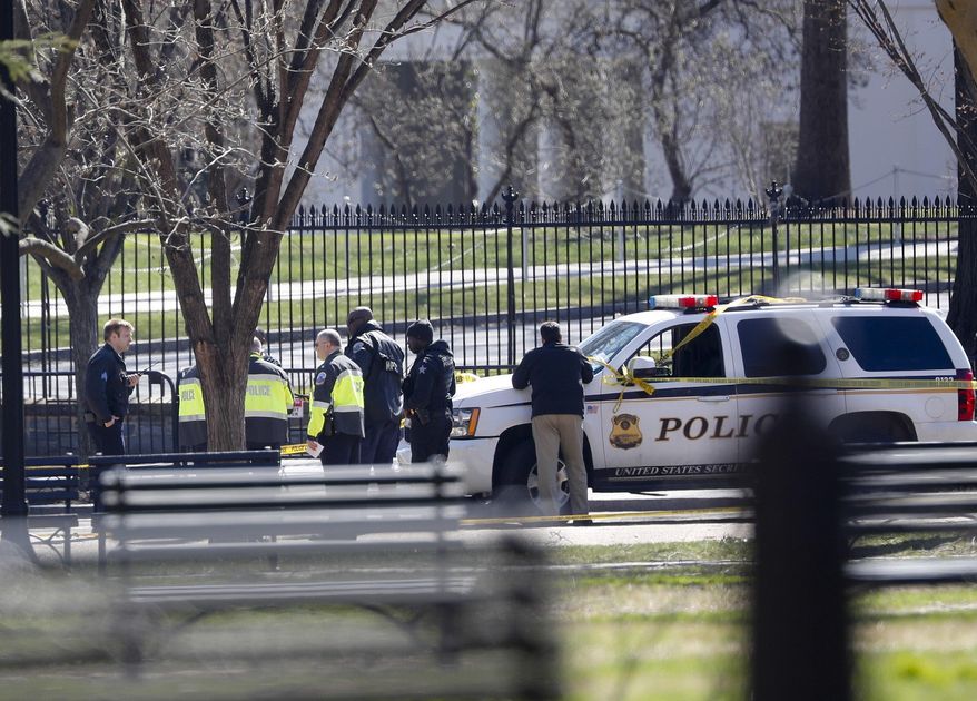 Law enforcement officers gather infront of the White House in Washington, Saturday, March 3, 2018. The Secret Service says a man shot himself outside the White House, and medical personnel are on the scene. President Donald Trump is not at the White House, he's in Florida, but is set to return later Saturday. The agency says in a Twitter post that there are no other reported injuries related to the incident. (AP Photo/Pablo Martinez Monsivais)