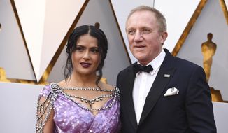 Salma Hayek, left, and Francois-Henri Pinault arrive at the Oscars on Sunday, March 4, 2018, at the Dolby Theatre in Los Angeles. (Photo by Jordan Strauss/Invision/AP)