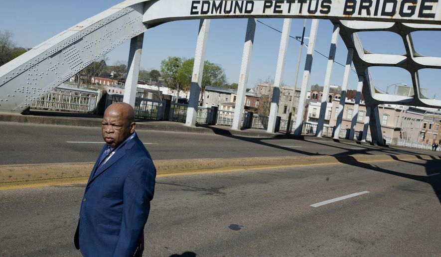 Congressman John Lewis stands on the Edmund Pettus Bridge on Sunday, March 4, 2018, in Selma, Ala., during the annual commemoration of &amp;quot;Bloody Sunday,&amp;quot; the day in 1965 when voting rights protesters were attacked by police as they attempted to cross the Edmund Pettus Bridge.  (Albert Cesare/The Montgomery Advertiser via AP)