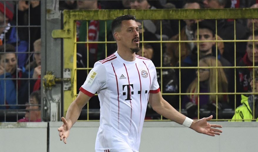 Munich's Sandro Wagner celebrates his side's third goal during the German Bundesliga soccer match between SC Freiburg and Bayern Munich, in Freiburg, Germany, Sunday, March 4, 2018. (Patrick Seeger/dpa via AP)