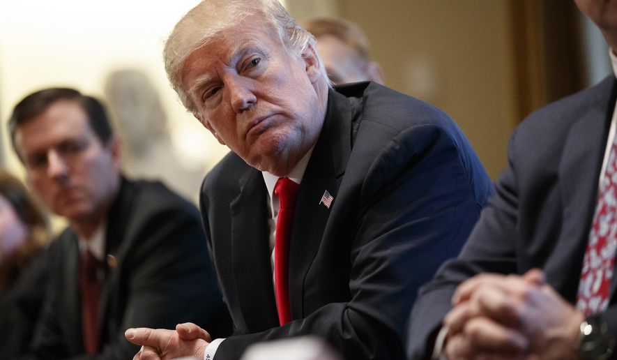 President Donald Trump listens during a meeting with steel and aluminum executives in the Cabinet Room of the White House on March 1, 2018. (Associated Press) **FILE**