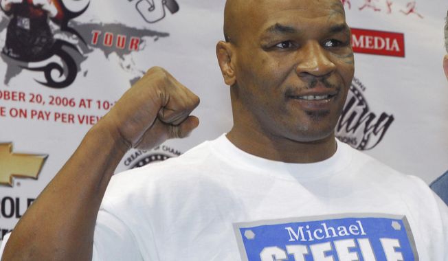 FILE - In a Thursday, Oct. 19, 2006 file photo, former heavyweight champion Mike Tyson pumps his fist in the air during his weigh-in at the Chevrolet Centre in Youngstown, Ohio. Living Word Sanctuary Church is converting a Southington Township, Ohio mansion once owned by Tyson into a house of worship. (AP Photo/Mark A. Stahl, File)