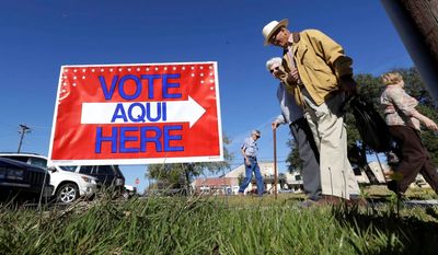 At the polling place in the Lone Star State: voters leave the town courthouse after casting their ballot in Blanco, Texas. (Associated Press)