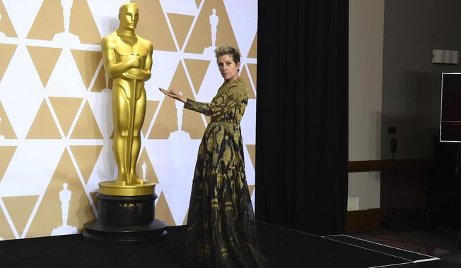 Frances McDormand, winner of the award for best performance by an actress in a leading role for "Three Billboards Outside Ebbing, Missouri", poses in the press room at the Oscars on Sunday, March 4, 2018, at the Dolby Theatre in Los Angeles. (Photo by Jordan Strauss/Invision/AP)