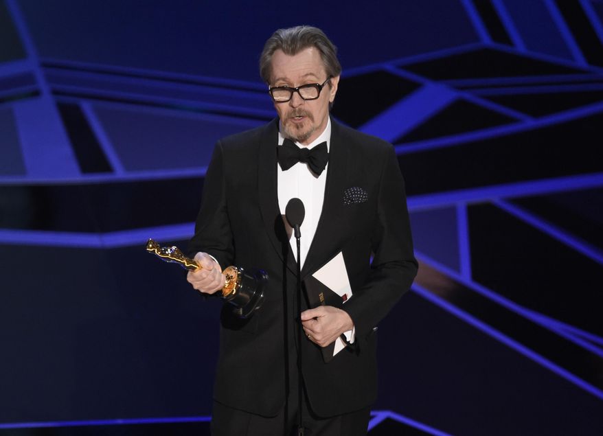 Gary Oldman accepts the award for best performance by an actor in a leading role for "Darkest Hour" at the Oscars on Sunday, March 4, 2018, at the Dolby Theatre in Los Angeles. (Photo by Chris Pizzello/Invision/AP)