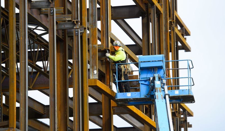 A steel worker builds a structure in Ottawa, Ontario, Monday, March 5, 2018. President Donald Trump insisted Monday that he's "not backing down" on his plan to impose stiff tariffs on imported steel and aluminum despite anxious warnings from House Speaker Paul Ryan and other congressional Republicans of a possible trade war. (Sean Kilpatrick/The Canadian Press via AP)