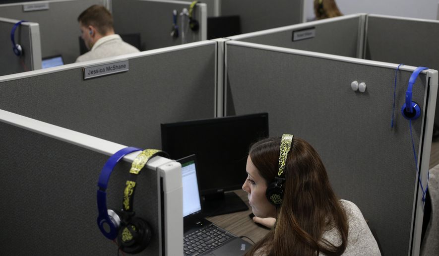In this Nov. 8, 2017, photo, Jessica McShane, an employee at Interactions Corp., foreground, monitors person-to-computer communications, helping computers understand what a human is saying, in the &amp;quot;intent analysis&amp;quot; room at the company&#x27;s headquarters in Franklin, Mass. “That information is used to feedback into the system using machine learning to improve our model,” said Robert Nagle, Interactions’ chief technology officer. “Next time through, we’ve got a better chance of being successful.” (AP Photo/Steven Senne)