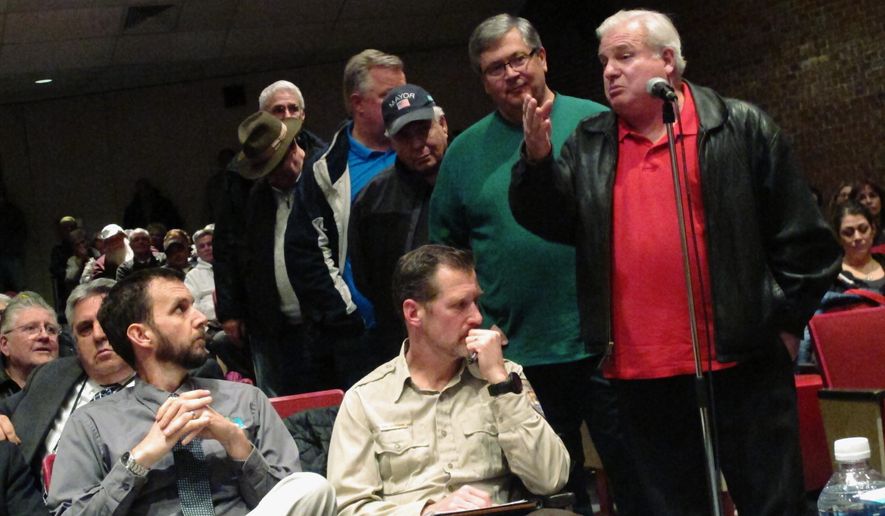 In this Feb. 27, 2018 photo, George Foreman speaks at a meeting in Brigantine, N.J., against New Jersey's plan to protect shorebirds by regulating driving on a section of beach. New Jersey’s plan to protect threatened shorebirds by taking control of who can drive on a stretch of pristine beach has ruffled some feathers in a town accustomed to motoring across the sand. The state Department of Environmental Protection has begun issuing permits allowing vehicles to drive on the northernmost beaches of Brigantine, a popular coastal town just north of Atlantic City. (AP Photo/Wayne Parry)