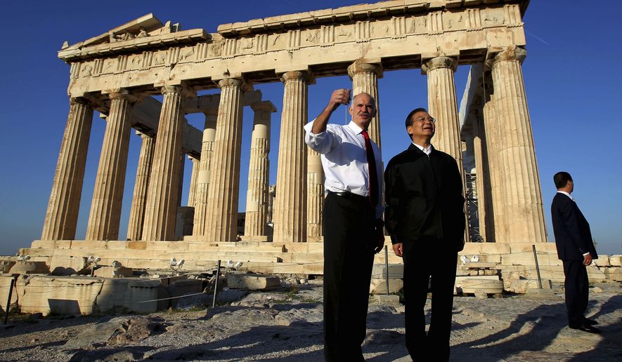 Greek Prime minister George Papandreou, left, and his Chinese counterpart Wen Jiabao pose for a picture in front of the ancient Parthenon temple at the Acropolis hill in Athens, Sunday, Oct. 3, 2010. Wen vowed Saturday to double trade with Greece within five years, and to buy Greek bonds when the crisis-hit country returns to international markets. (AP Photo/Petros Giannakouris)