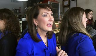 In this Feb. 13, 2018, photo, Democratic candidate for the 3rd congressional district Marie Newman speaks with supporters at a campaign event in LaGrange, Ill. Ahead of the fall midterm elections, Democrats have contested primaries around the country that will help shape their general election matchups against Republicans this fall. Newman is challenging Rep. Dan Lipinski, D-Ill., in the March 20 primary. (AP Photo/Sara Burnett) **FILE**